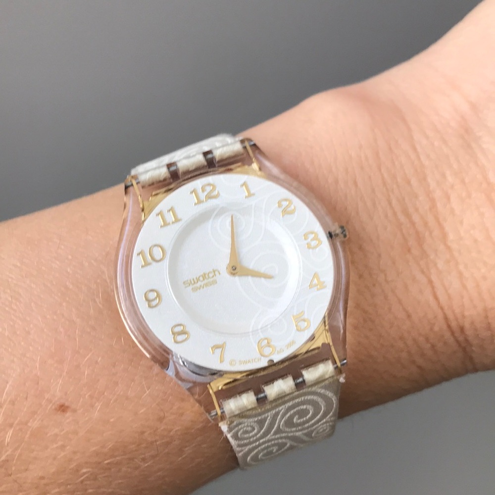 Swatch Cream and Gold Watch with Round Face and Textured Band. Water resistant